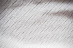 fond de texture de tissu de maillot de sport blanc photo