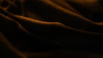 élégante texture de tissu doré premium avec fond noir photo