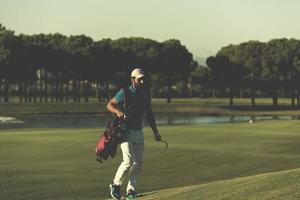 sac de marche et de transport de golfeur photo