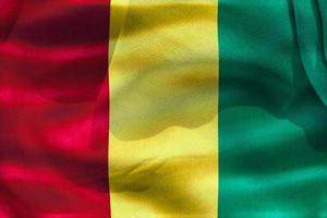 drapeau de la guinée - drapeau en tissu ondulant réaliste photo