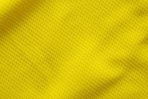 couleur jaune maillot de football vêtements tissu texture vêtements de sport arrière-plan, gros plan photo