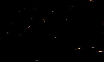 des étincelles rouges brûlantes volent d'un grand feu dans le ciel nocturne. beau fond abstrait sur le thème du feu, de la lumière et de la vie. photo