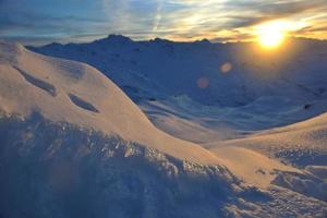 coucher de soleil neige montagne photo