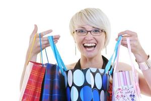 Happy young adult women shopping avec des sacs colorés photo