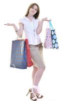 Happy young adult women shopping avec des sacs colorés photo