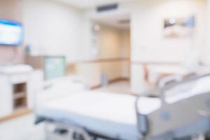 intérieur flou abstrait de la chambre d'hôpital avec lit médicalisé pour le fond photo