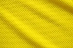 couleur jaune maillot de football vêtements tissu texture vêtements de sport arrière-plan, gros plan photo