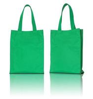 Sac en tissu vert sur fond blanc photo