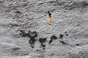 vue rapprochée détaillée sur les murs en béton vieilli avec des fissures et beaucoup de structure photo