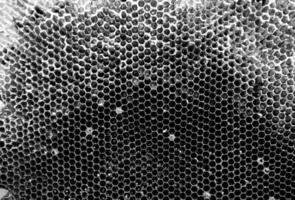 la structure hexagonale abstraite est en nid d'abeille de la ruche d'abeilles photo