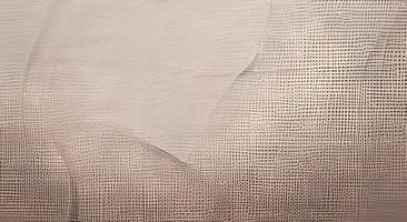 texture de tissu semblable au lin dans les tons ocre et beiges, adaptée à une utilisation sur différentes surfaces telles que la céramique, les papiers, les dessins graphiques, le bois, etc. photo