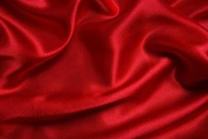 texture de fond de vagues de tissu rouge. photo