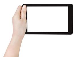 main d'enfant tenant un tablet pc isolé photo
