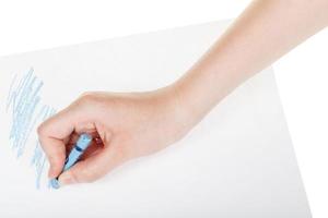 Peintures à la main par crayon bleu sur feuille de papier photo
