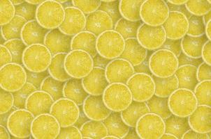 motif de tranches d'agrumes de citron jaune. pose à plat d'agrumes photo