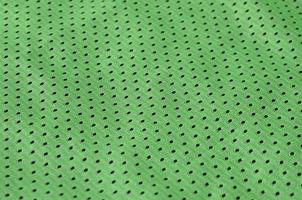 texture de vêtements de sport en fibre de polyester. les vêtements d'extérieur pour l'entraînement sportif ont une texture en maille de tissu en nylon extensible photo