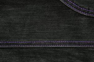 la texture du tissu denim noir photo