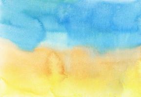 texture de fond aquarelle jaune et bleu vif. toile de fond aquarelle ombre. taches sur papier, peintes à la main. photo