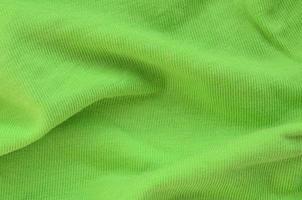 la texture du tissu est vert vif. matériel pour faire des chemises et des chemisiers photo