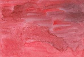 texture de fond rouge aquarelle peinte à la main. toile de fond artistique couleur corail, coups de pinceau sur papier. superposition liquide photo