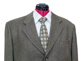 Veste en tweed vert avec chemise et cravate close up photo