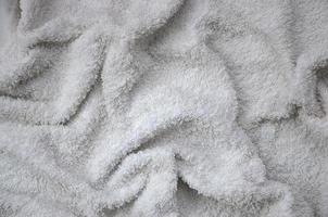 texture de fond de serviette en coton naturel blanc avec de nombreux plis photo