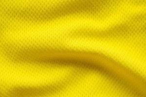 couleur jaune maillot de football vêtements tissu texture vêtements de sport arrière-plan, gros plan photo