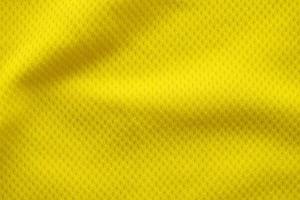 couleur jaune maillot de football vêtements tissu texture vêtements de sport arrière-plan, gros plan photo