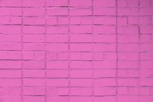 mur de briques peintes en rose mat fond plat plein cadre et texture photo