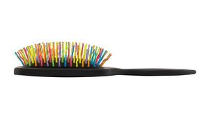 Nouvelle brosse à cheveux pastic coloré arc-en-ciel isolé sur fond blanc photo