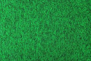 texture tricotée mélange vert et noir et fond plat photo