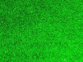 utilisation de la texture de l'herbe verte comme arrière-plan naturel. fond d'écran pour les illustrations de conception photo