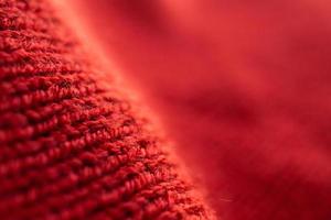 fond de texture de tissu de laine tricoté rouge gros plan photo