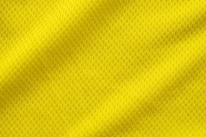 couleur jaune maillot de football vêtements tissu texture vêtements de sport arrière-plan, gros plan photo