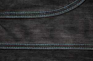 la texture du tissu denim noir photo