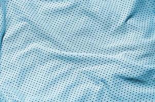 fond de texture de tissu de vêtements de sport, vue de dessus de la surface textile en tissu bleu clair photo