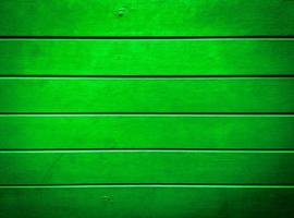 texture de planche de bois verte pour le fond de décoration. fond d'écran pour la conception photo