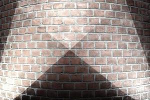 textures de mur de briques vieillies et altérées avec un éclairage par projecteur très lumineux photo