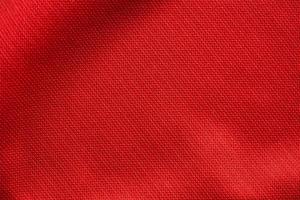 tissu de vêtements de sport rouge texture de maillot de football gros plan photo