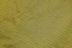 fond de texture de tissu de vêtements de sport. vue de dessus de la surface textile en tissu. maillot de basket coloré avec espace de texte photo