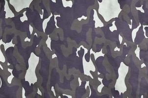 texture de tissu avec un camouflage peint aux couleurs du marais. image de fond de l'armée photo
