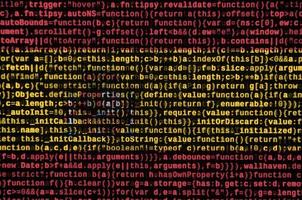 drapeau espagnol est représenté sur l'écran avec le code du programme. le concept de technologie moderne et de développement de site photo