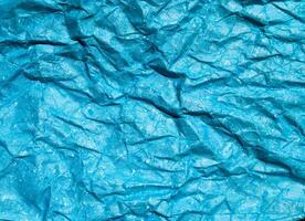 texture de fond de papier froissé bleu pour la conception photo