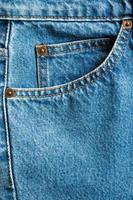 Poche de jeans denim bleu texture background closeup photo