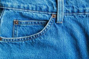 Poche de jeans denim bleu texture background closeup photo