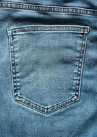 fond de poche de jeans en denim bleu photo