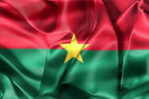 drapeau du burkina faso - drapeau en tissu ondulant réaliste photo