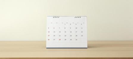 page de calendrier gros plan sur une table en bois avec fond de mur blanc concept de réunion de rendez-vous de planification d'entreprise photo