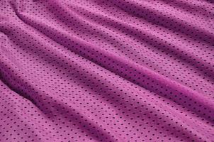 texture de vêtements de sport en fibre de polyester. les vêtements d'extérieur pour l'entraînement sportif ont une texture en maille de tissu en nylon extensible