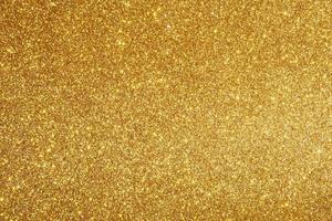 fond abstrait paillettes d'or scintillant photo